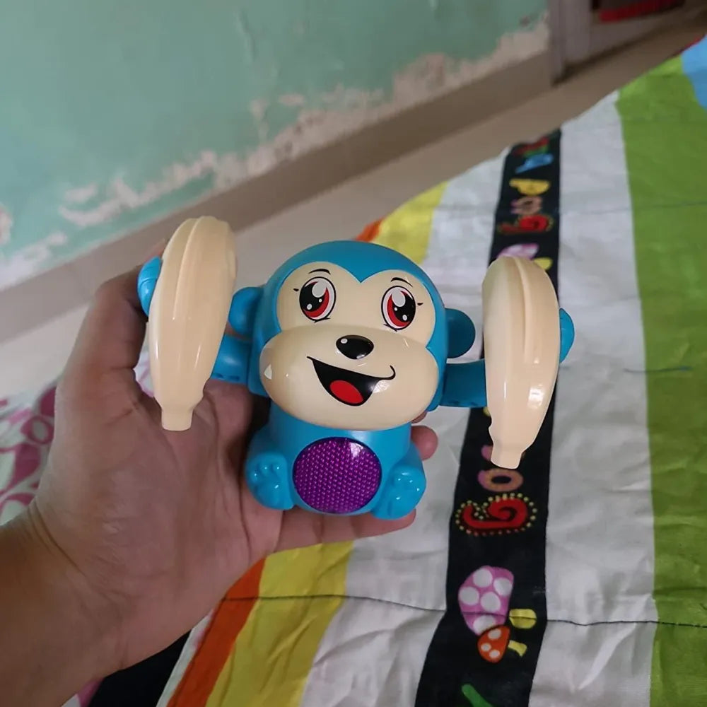 Blue monkey toy with banana-shaped cymbals.