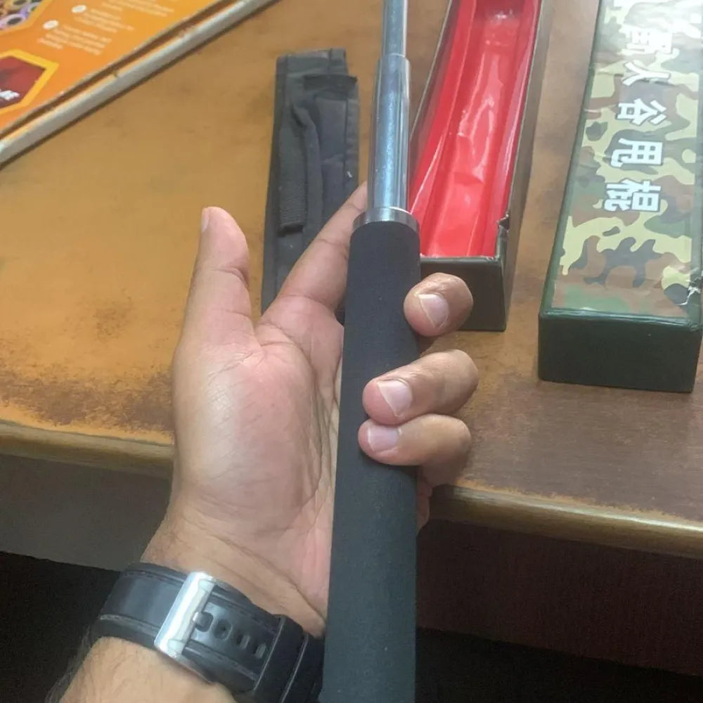 Extendable black baton.