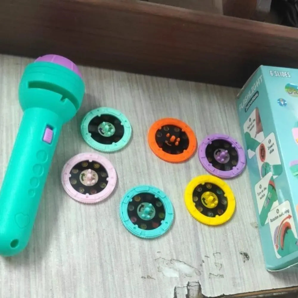 Turquoise and purple toy flashlight with interchangeable lenses.