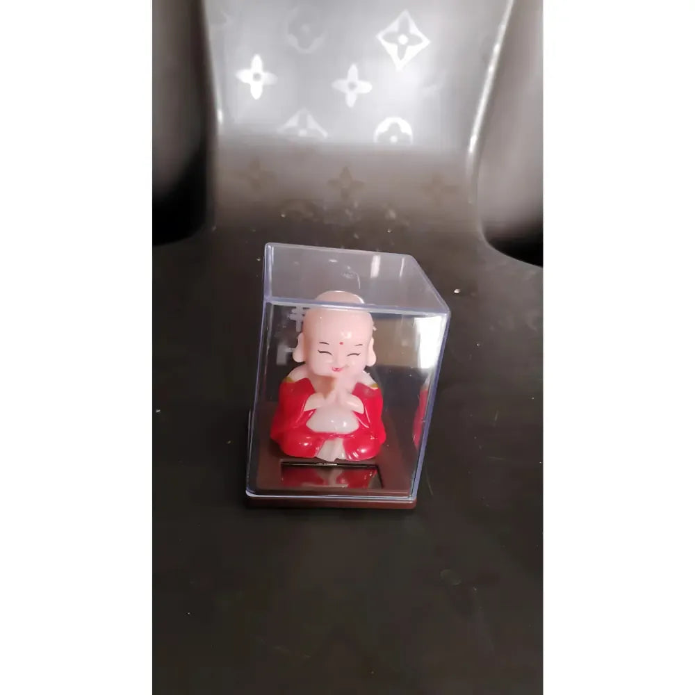 Solar-powered nodding buddha ornament - automotive