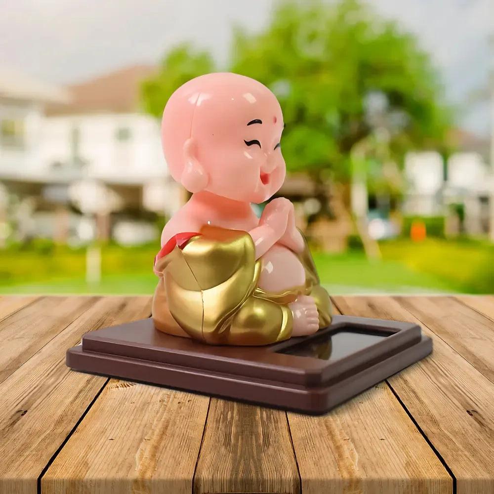 Solar-powered nodding buddha ornament - automotive