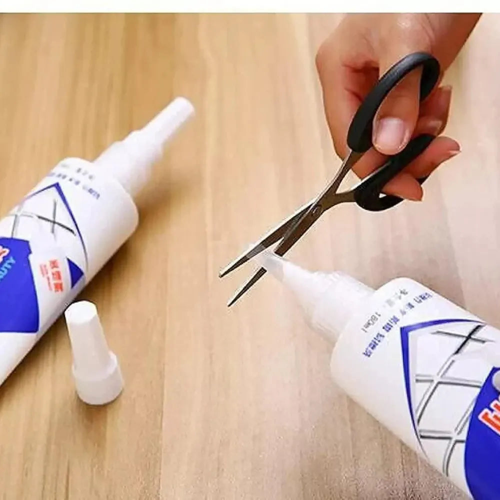 White tube of seam beauty agent being cut open with scissors.