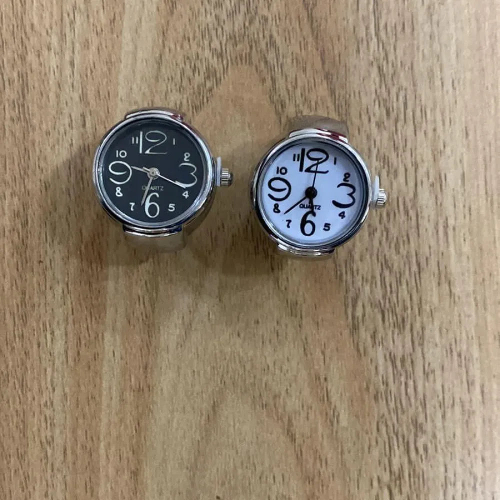 Two finger-ring watches.