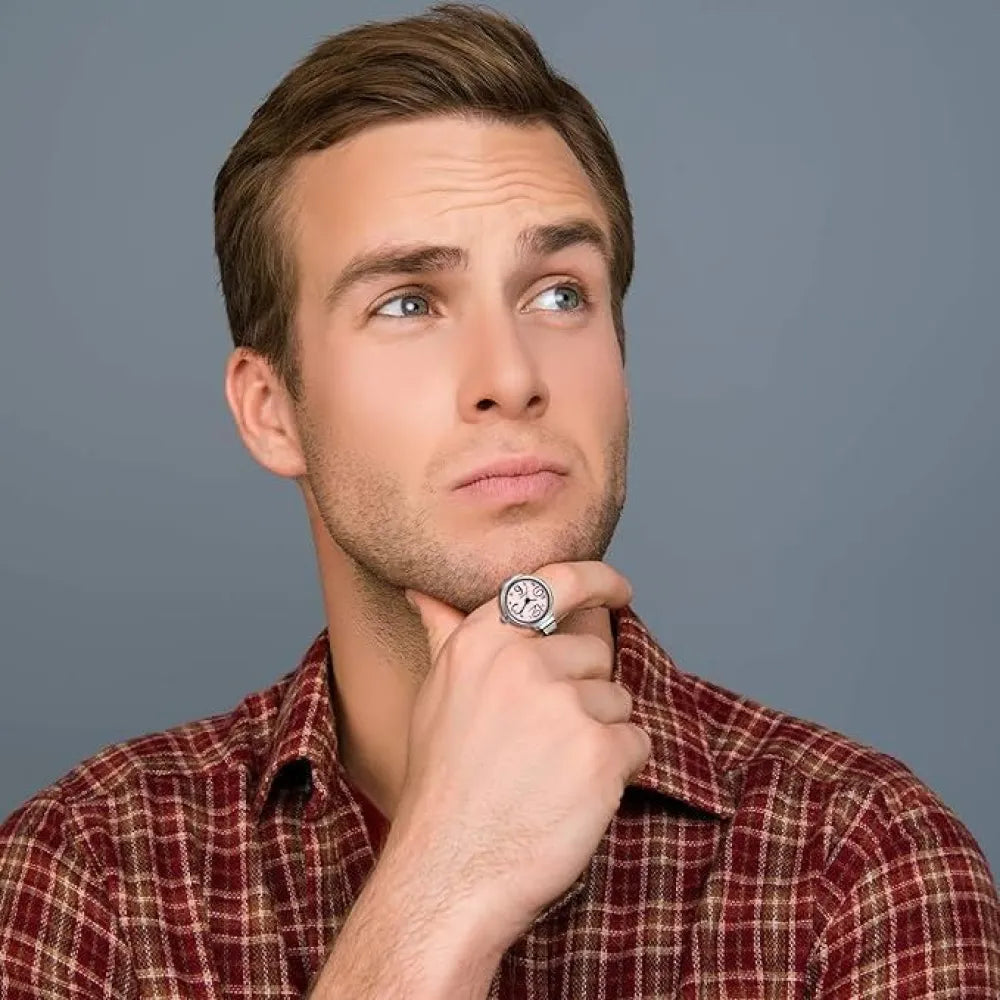 Pensive man with a ring.