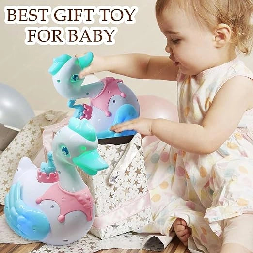 Musical swan egg-laying toy