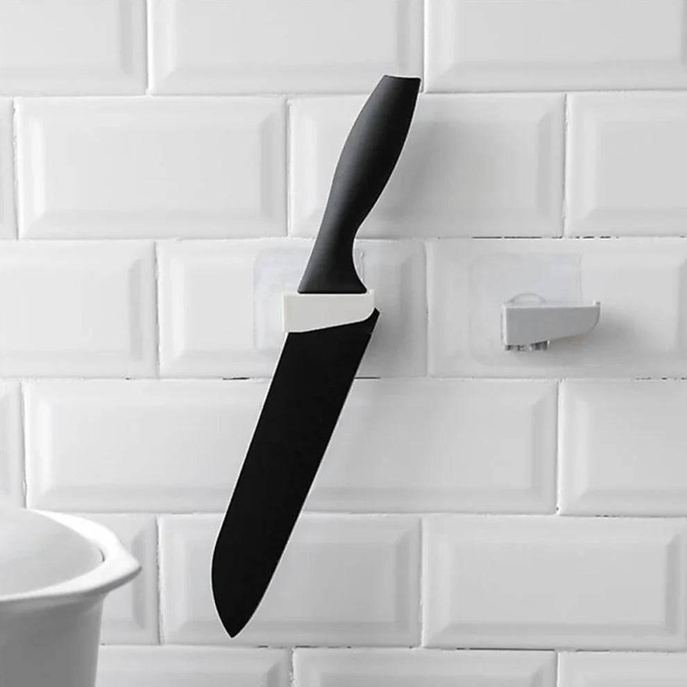 Self-adhesive wall knife holder