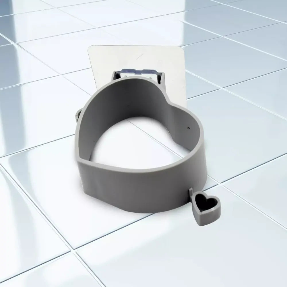 Adhesive hair dryer holder