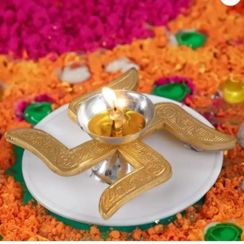 Brass swastik diya