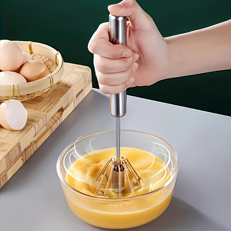 Push-button egg whisk