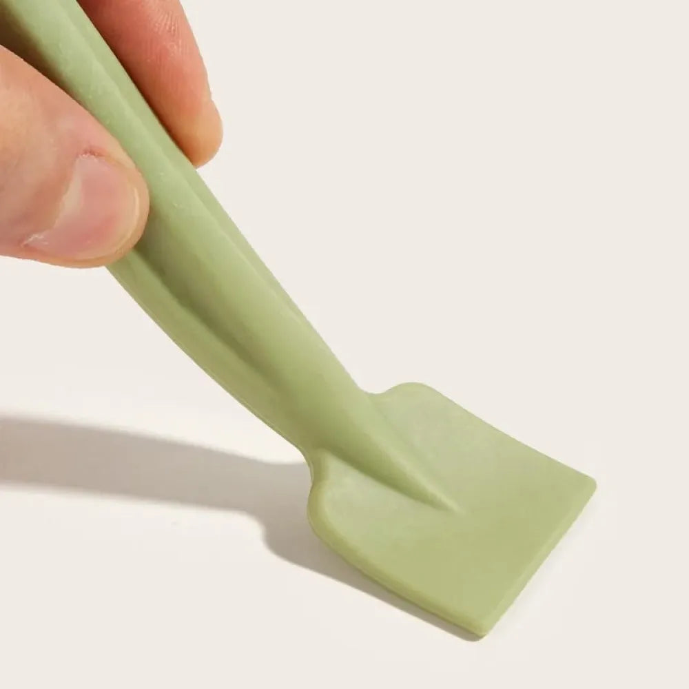 Double-headed face brush