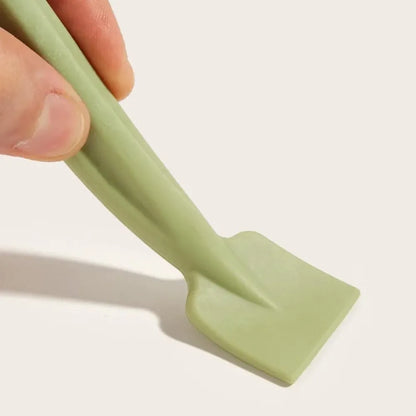 Double-headed face brush