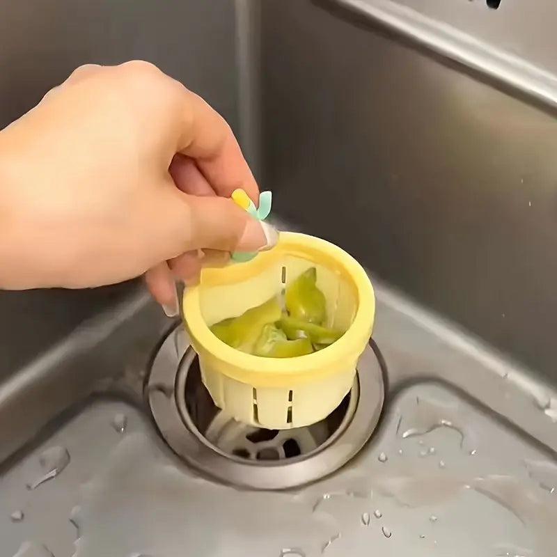 Self-cleaning sink strainer
