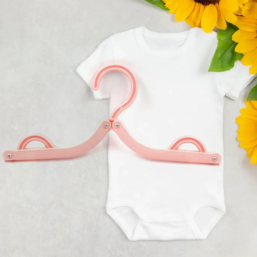 Foldable travel hangers with clips