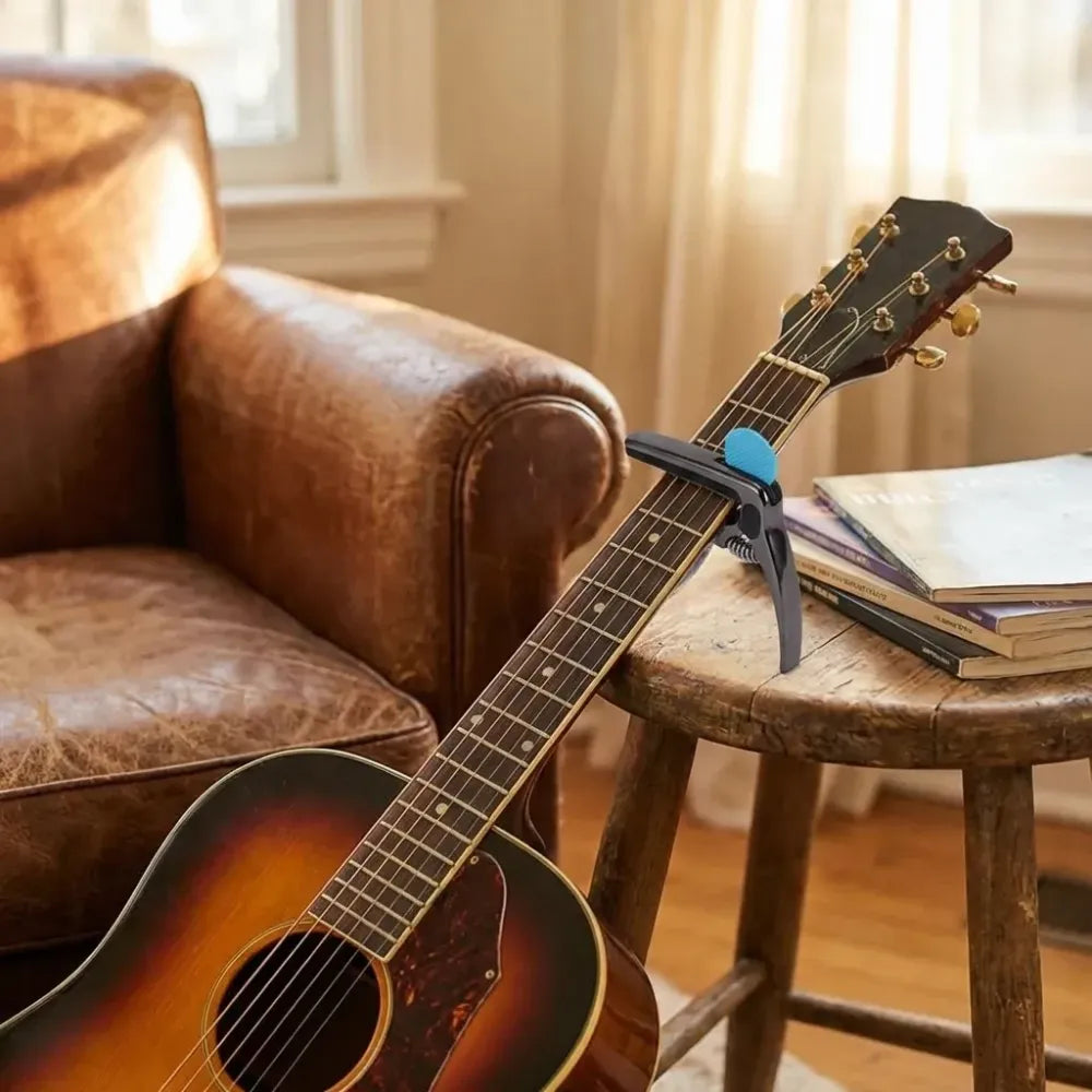 Guitar capo with pick holder - home improvement
