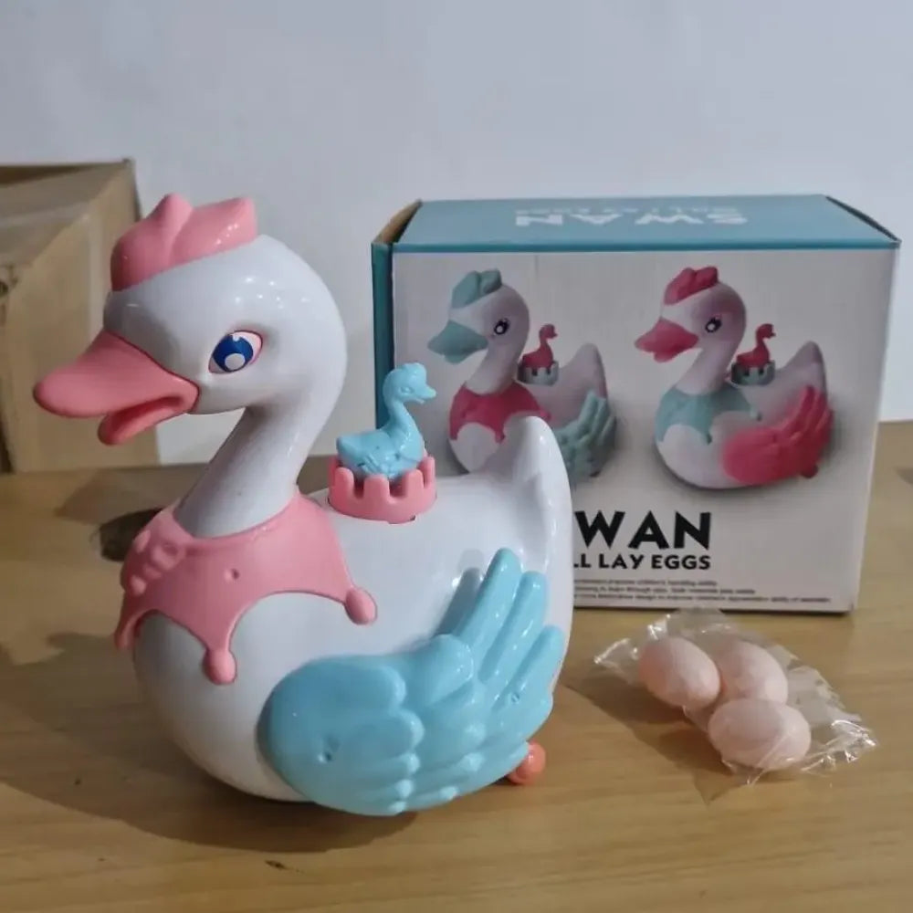 Musical swan egg-laying toy
