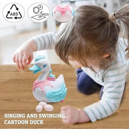 Musical swan egg-laying toy