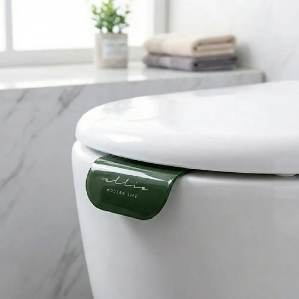 No-touch toilet seat lifters