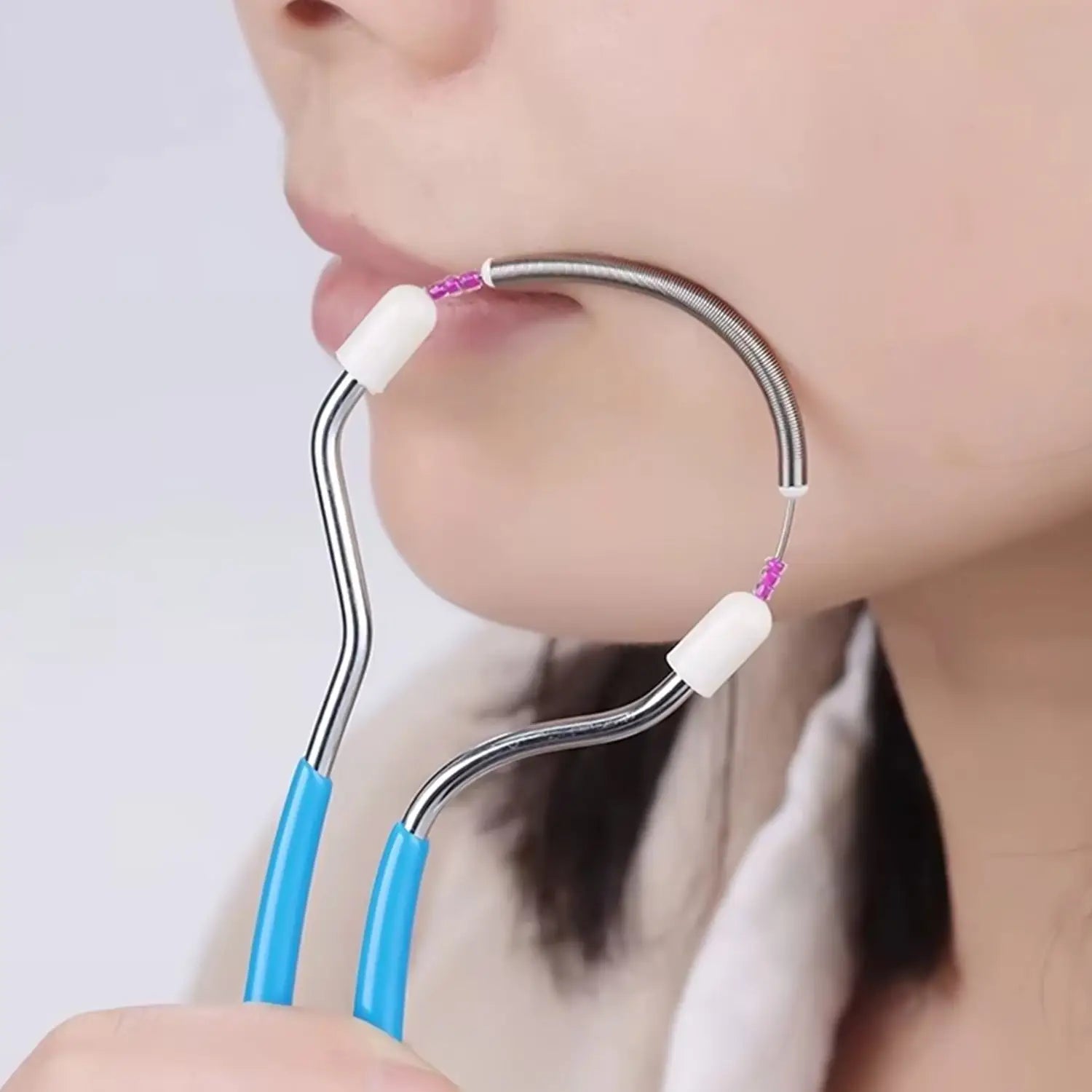 Portable facial hair remover spring