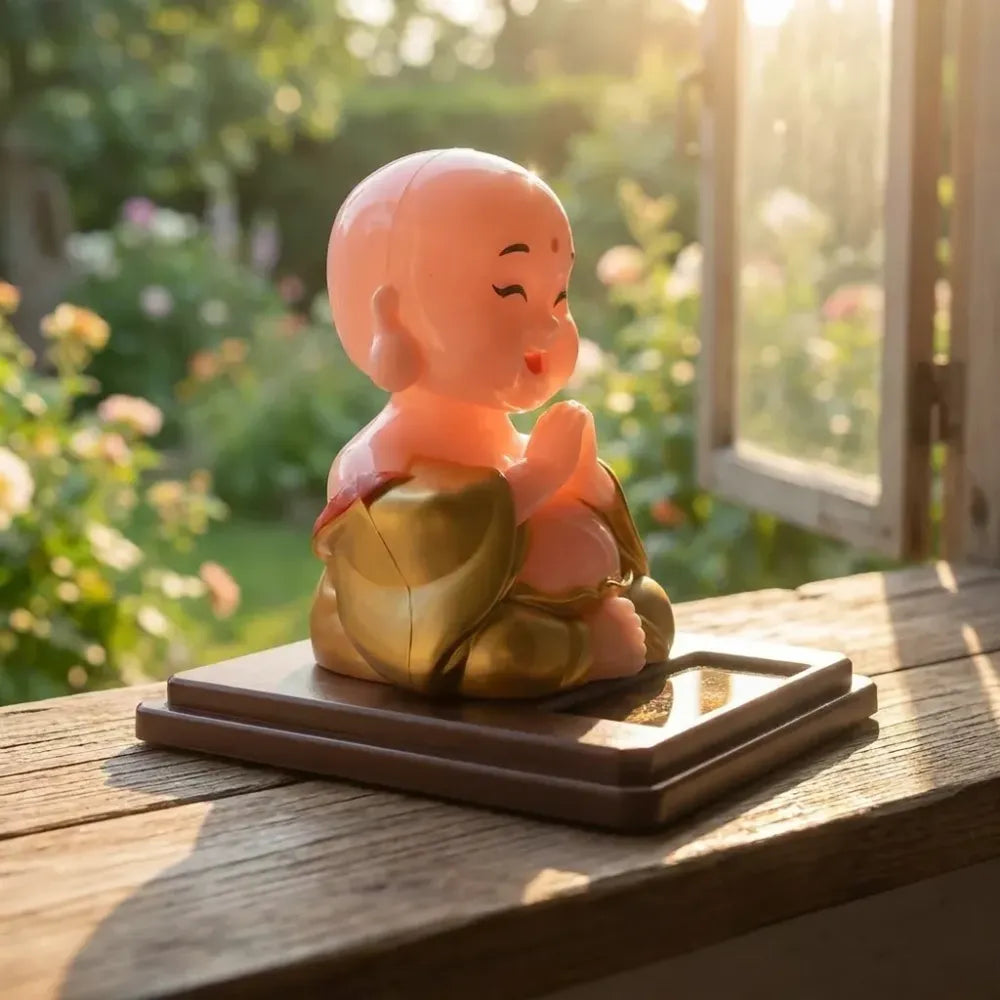 Solar-powered nodding buddha ornament - automotive