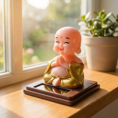 Solar-powered nodding buddha ornament - automotive