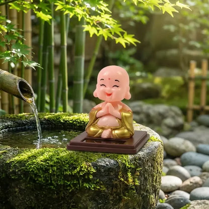 Solar-powered nodding buddha ornament - automotive